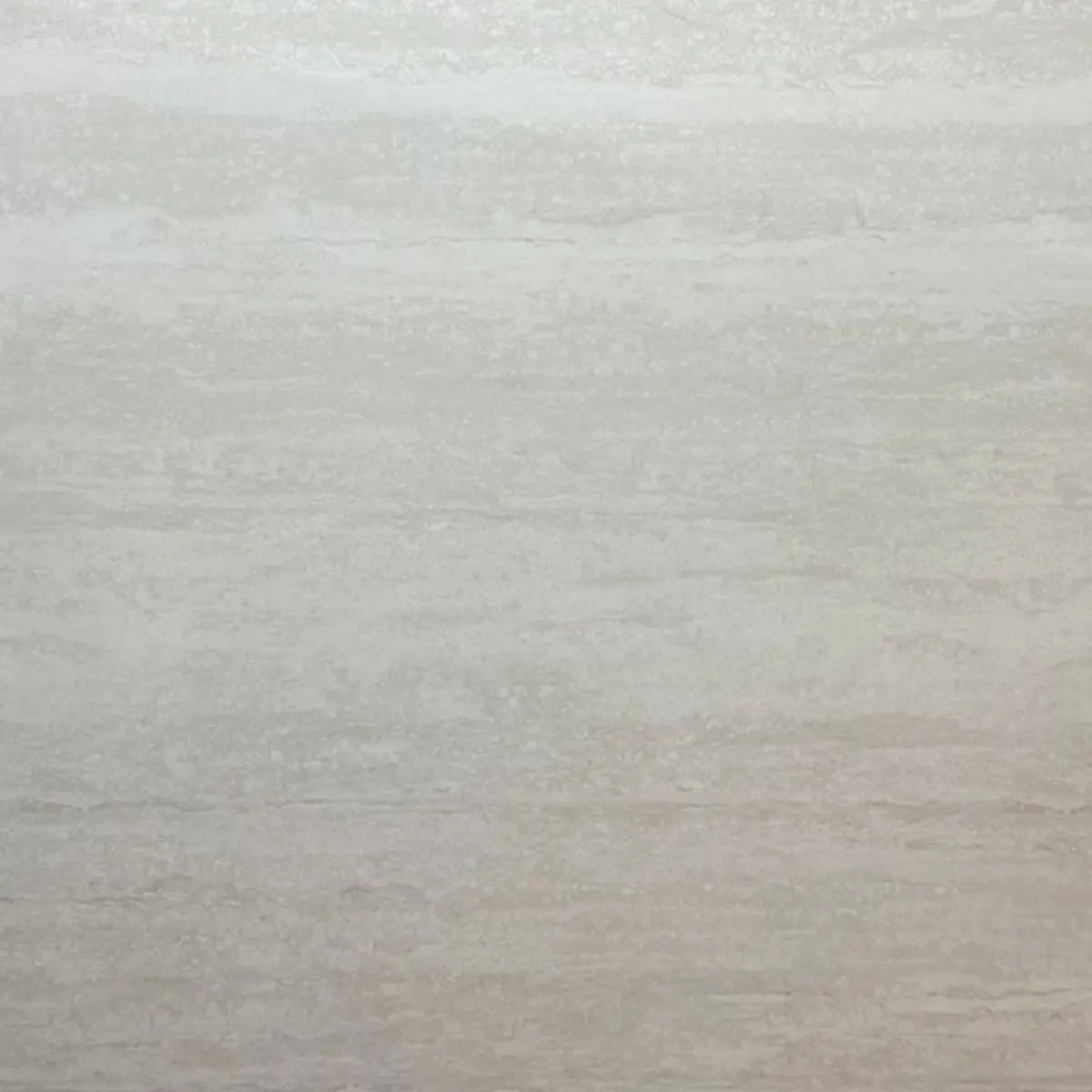 Sinterium Crema Travertino — muestra de superficie sinterizada